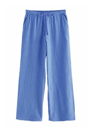 Pantaloni a gamba larga di colore blu chiaro realizzati in tessuto texture. Presentano una vita elastica con cordoncino da annodare e tasche laterali.