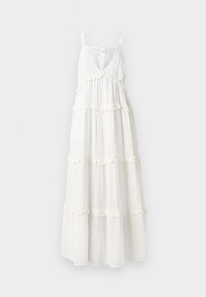 Robe maxi blanche avec un décolleté en V profond, des fines bretelles et des volants superposés le long de l'ourlet. Fabriquée en tissu léger et fluide pour le confort.