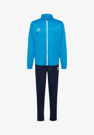 Blaues Sporttracksuit mit einer Reißverschlussjacke mit weißen Akzenten und dunkelblauen Hose. Hergestellt aus leichtem Stoff für Komfort und Beweglichkeit.