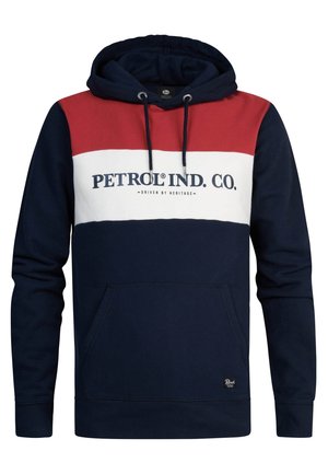 Sudadera con capucha que presenta un diseño de bloques de color en azul marino, rojo y blanco. Tiene un bolsillo tipo canguro en la parte delantera y un logo en el pecho.