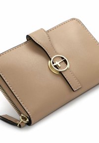 Beige leather wallet with a smooth texture, featuring a gold circular hardware accent and a secure flap closure. Zipper detail visible.