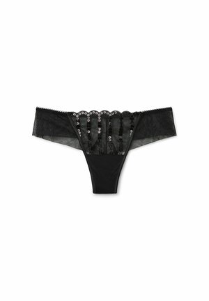 Black thong made of sheer fabric with scalloped lace trim and decorative sequins along the waistband, featuring a smooth texture and minimal coverage.