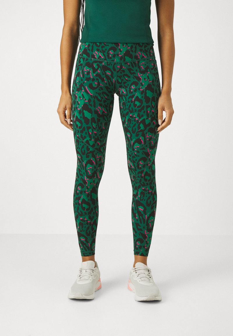 Gröna leggings med leopardtryck och rosa detaljer, tillverkade av elastisk tyg. Har en hög midja och en slimmad passform.