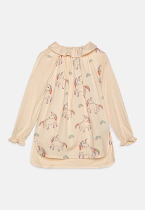 Creméfarbene langärmlige Bluse mit gerafftem Kragen und Manschetten, versehen mit einem bunten Einhorn- und Regenbogenmuster.