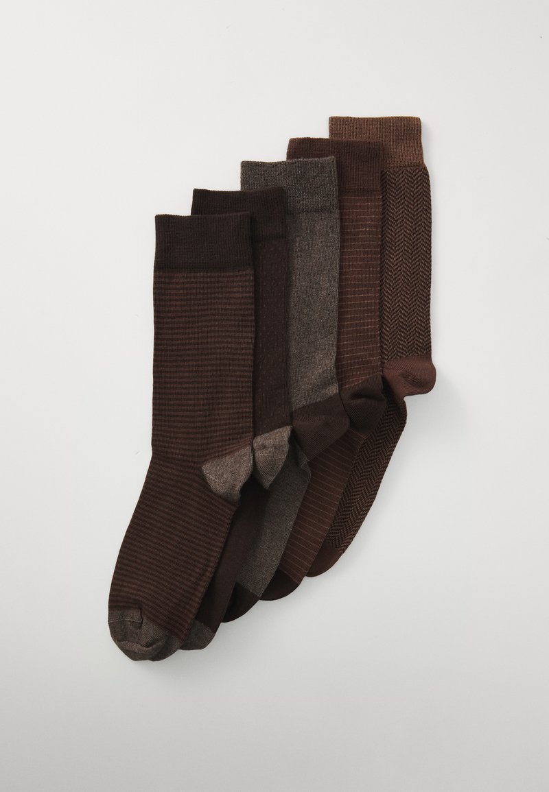Set of five pairs of brown socks with varied textures and designs: stripes, solid, and herringbone patterns in dark to light shades.