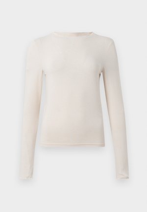 Beige long-sleeve crew neck shirt with fitted silhouette, displayed flat against a light background.