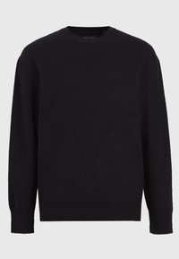 Schwarzer Rundhalsausschnitt-Pullover aus weicher Wolle. Lange Ärmel, gerippte Bündchen und Saum sowie ein einfaches Design ohne Muster oder Verzierungen.