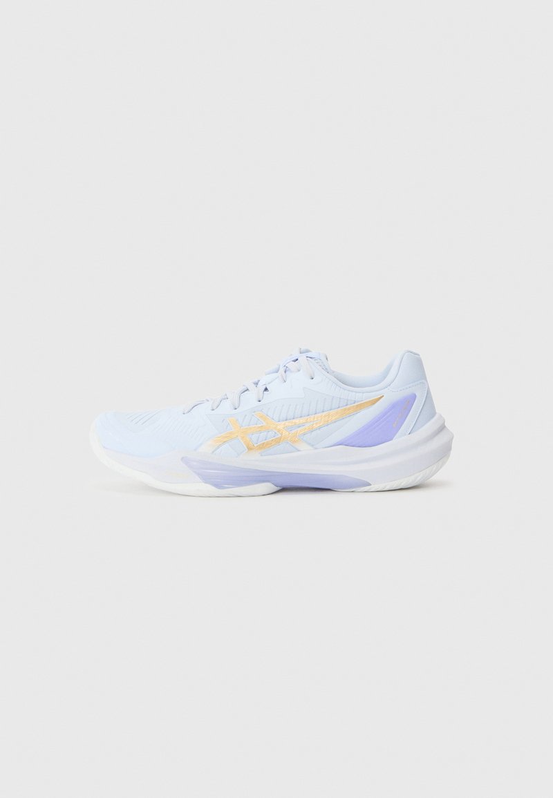 Light blue athletic shoe with a textured upper, featuring a gold zigzag design and purple accents on the sole and heel.