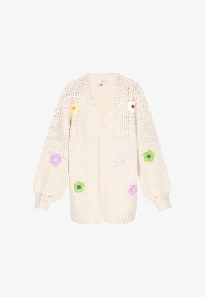 Krāšņs adījuma kardigans krēmkrāsā ar balonu piedurknēm, rotāts ar ziedu apdari dzeltenā, rozā un zaļā krāsā. Atvērta priekšpuse.