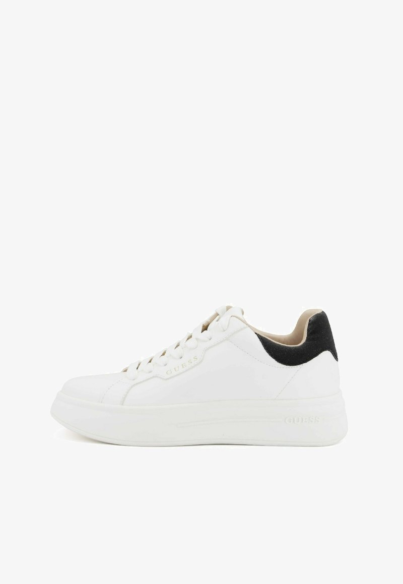 White leather sneakers with a black suede heel. Features a round toe, flat rubber sole, and lace-up design with embossed branding.