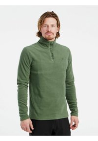 Pullover in pile verde con colletto alto, chiusura frontale con zip e tessuto testurizzato. Presenta un logo sul petto e maniche lunghe aderenti.