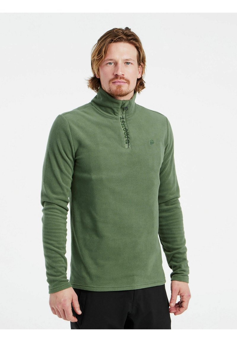 Pullover in pile verde con colletto alto, chiusura frontale con zip e tessuto testurizzato. Presenta un logo sul petto e maniche lunghe aderenti.