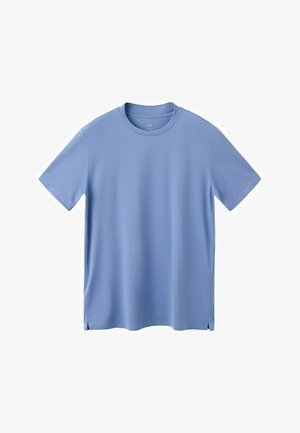 Vaaleansininen lyhythihainen pyöreäkauluksinen t-paita, jossa on sivuhalkiot ja sileä, yksivärinen kangaspinta.