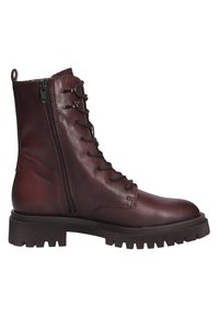 Brown leather ankle boots with a lace-up front, side zipper, and chunky rubber sole featuring a textured tread pattern.
