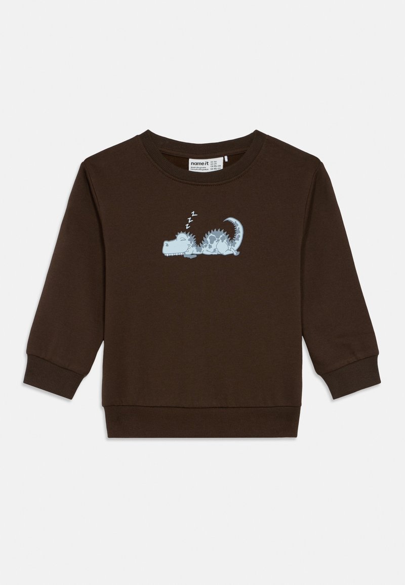 Sweat-shirt à manches longues couleur brun foncé pour tout-petit avec un petit motif graphique représentant un dinosaure bleu endormi et « zzz » au-dessus de sa tête sur la poitrine.