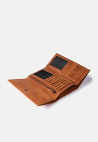 Brown leather wallet with multiple card slots, clear ID windows, and a zippered compartment, featuring a smooth texture and clean seams.