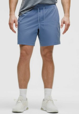 Blue athletic shorts with an elastic waistband and drawstring, made of smooth, lightweight fabric. Styled with a straight cut and no pockets.