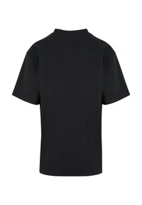 Black cotton t-shirt with a relaxed fit, short sleeves, and a crew neckline. Smooth texture with no visible patterns or accents.
