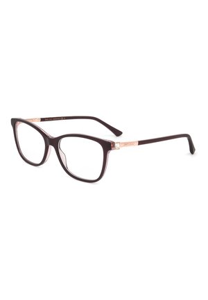 Occhiali da vista a occhi di gatto marrone scuro con lenti trasparenti e dettagli in oro rosa sulle aste, inclinati su sfondo bianco.