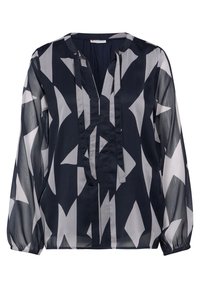 Marineblaue Bluse aus leichtem Stoff mit einem geometrischen weißen Muster. Sie hat einen V-Ausschnitt und lange, gepuffte Ärmel mit elastischen Bündchen.