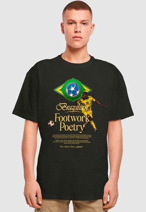 Black t-shirt featuring a vibrant yellow and green Brazilian football graphic with text reading “Brazilian Footwork Poetry” and a player in action.