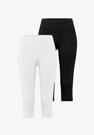 Schwarz-weiße Leggings, in cropped Länge, aus weichem, dehnbarem Material. Mit einem elastischen Bund und einer glatten Textur.