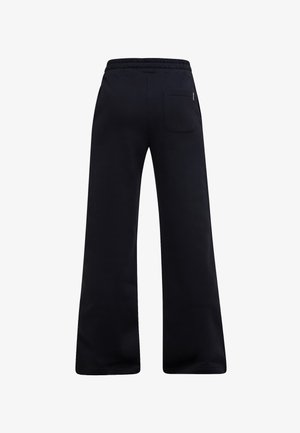 Pantaloni neri a gamba larga con cintura elastica e una tasca posteriore singola sul lato destro, visti da dietro.