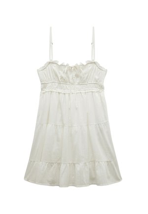 Vestido blanco sin mangas con un escote con volantes, tirantes ajustables, cintura elástica y falda en capas para una silueta fluida.