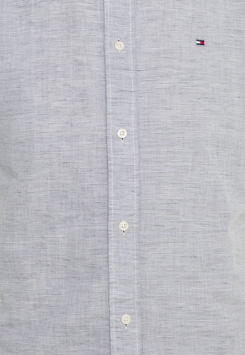 Vielfalt Steigung Reisender tommy hilfiger t shirt fake vs real Sake