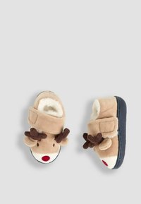 Ciabatte morbide beige con fodera in pile, caratterizzate da un design con faccia di renna, corna marroni, naso rosso e cinturino regolabile in Velcro.
