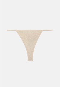 String beige en coton avec fines bandes élastiques sur les côtés, design simple, posé à plat sur un fond blanc.