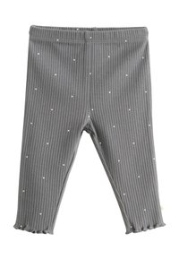 Leggings de rayas grises con lunares blancos, que cuentan con una cinturilla elástica y dobladillos fruncidos en los tobillos. Textura de tela suave.