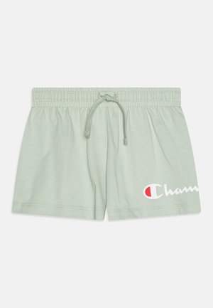 Jasnozielone bawełniane szorty z elastycznym paskiem i sznurkiem, z białym wzorem logo i starannie zszytymi brzegami.