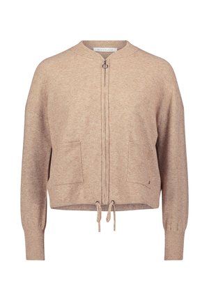 Beige Zip-Hoodie mit Rundhalsausschnitt, zwei Fronttaschen und Kordelzug am Saum. Weiche Textur mit gerippten Bündchen und einem lässigen Schnitt.