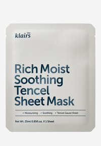Hvit emballasje med en teksturert finish, med mørkeblå tekst. Etikettene angir produkttype og fordeler, med Tencel-materiale nevnt.