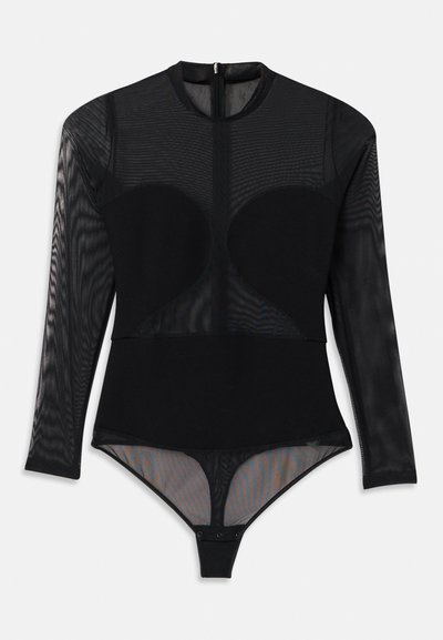 Svart bodysuit med en tettsittende design, gjennomsiktige lange ermer, rund hals og trykknappslukking nederst. Stoffets tekstur er glatt.