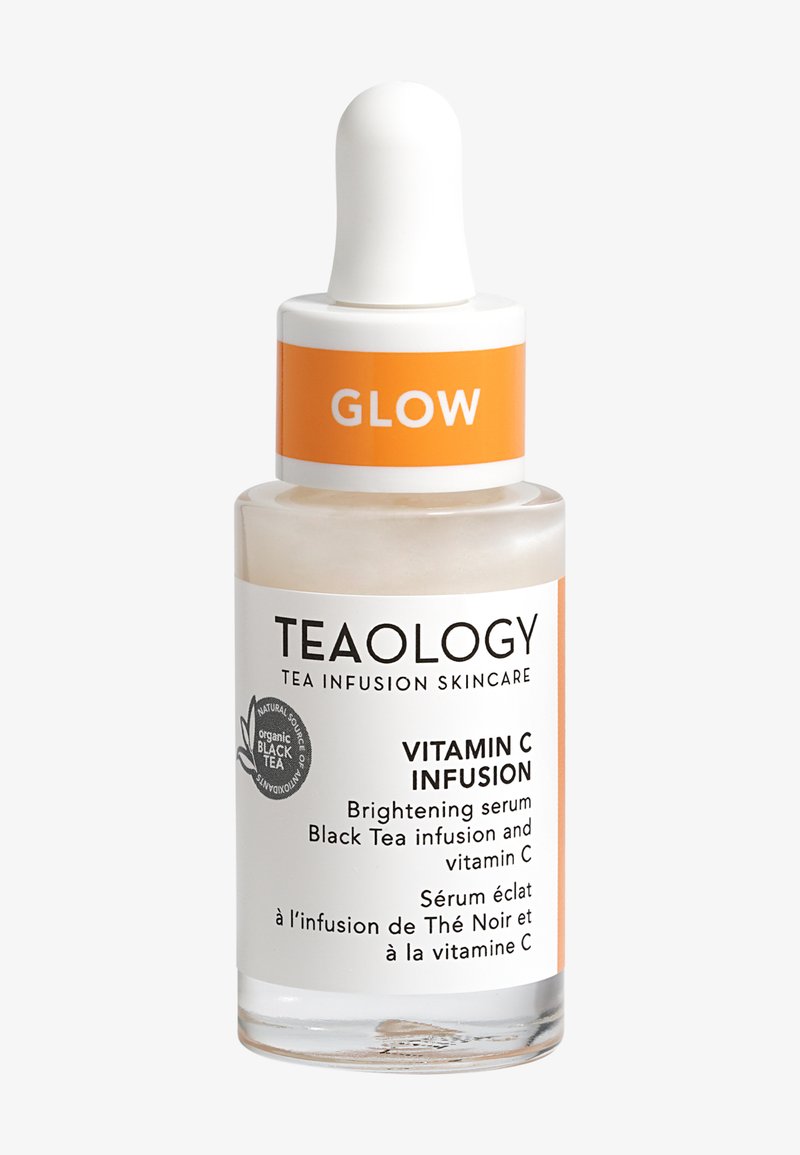 Flacon de sérum éclaircissant Glow Vitamin C Infusion avec pipette, arborant la marque Teaology et une étiquette d'infusion de thé noir.