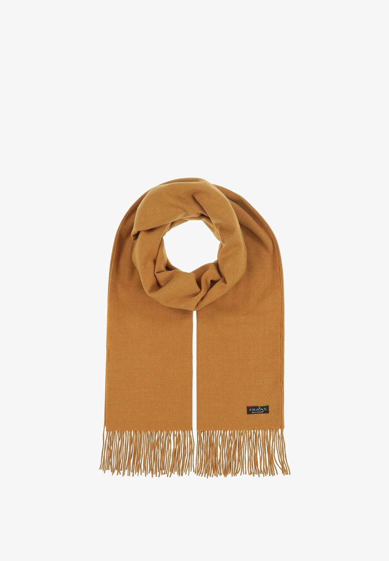 Mustard-colored scarf made of soft fabric, featuring fringed edges and subtle sparkles, with a tag that includes the brand logo.