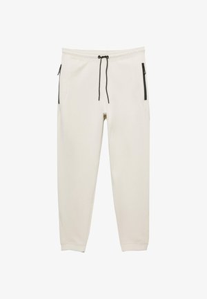 Vaaleanbeiget juoksuhousut, pehmeästä kankaasta valmistetut, joissa on kaksi vetoketjullista sivutaskua, säädettävä nyöri ja kapeat lahkeet.