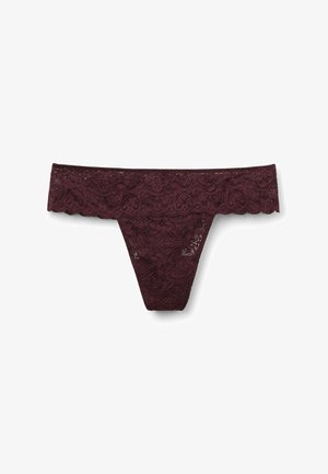Dark purple lace thong underwear with floral patterns and a scalloped waistband on a white background.