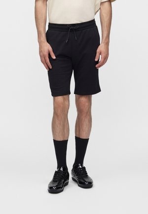 Jack & Jones JPSTGORDON BRADLEY - Tracksuit bottoms - black