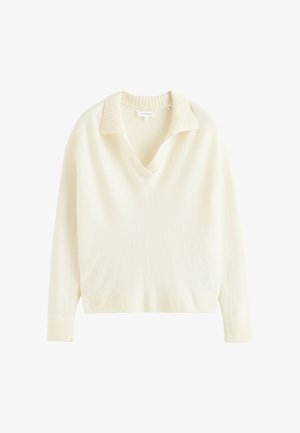 Maglione color crema con collo a V, rifiniture a coste sul colletto e sull'orlo, e maniche lunghe. Tessuto a maglia morbido.