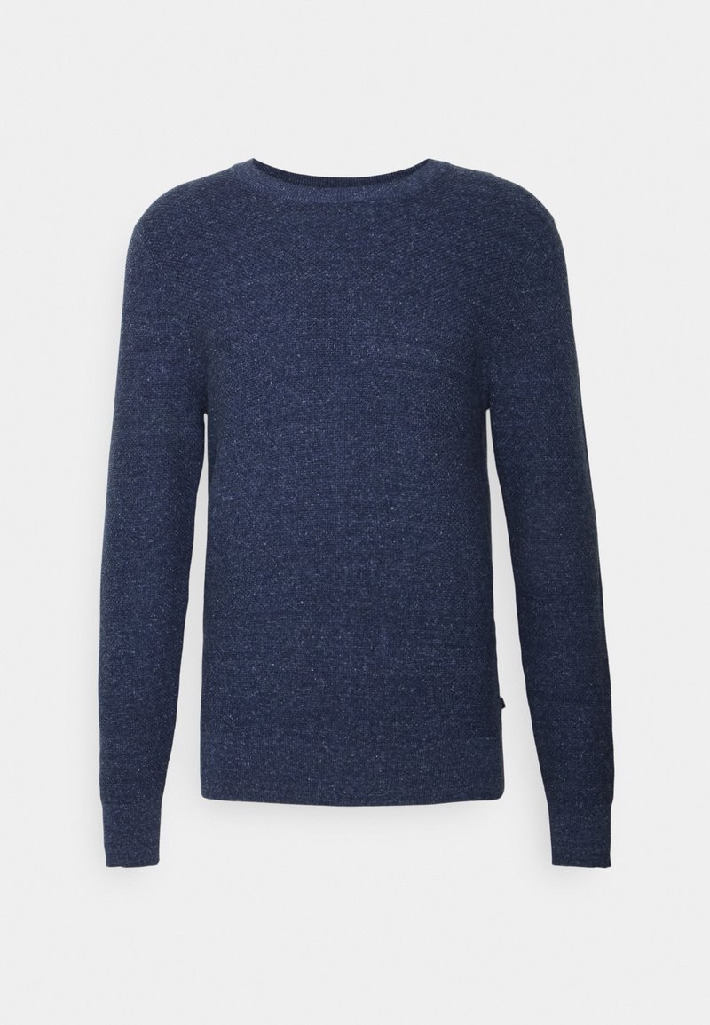 Pull homme bleu foncé à manches longues et col rond, en tissu tricoté doux et texturé, présenté sur un fond clair uni.