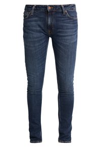 Mörkblå skinny jeans tillverkade av denim. Har dragkedja fram, bälteshällor och subtila urtvättningar. Traditionell femficksdesign.