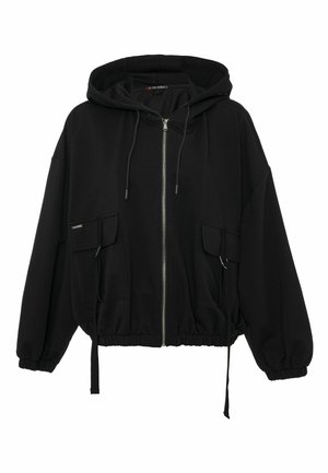 Sweat à capuche zippé noir à silhouette surdimensionnée, capuche à cordon réglable, deux poches avant, et ourlet et poignets élastiqués. Matière douce.