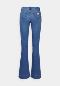 Wrangler FLARE - Calças de ganga à boca de sino - tidal wave