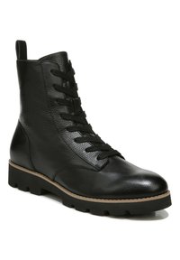 Black leather ankle boots with a textured finish, lace-up design, rounded toe, sturdy black sole, and a contrasting light brown welt.