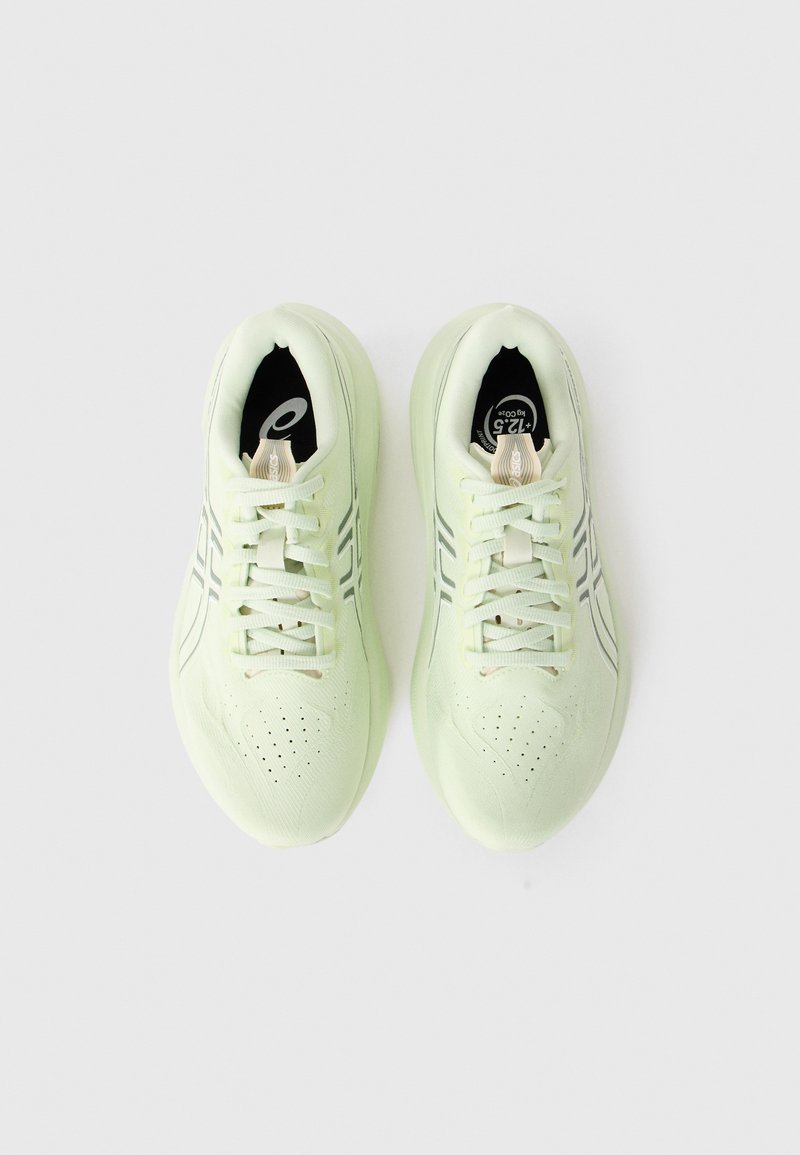 Lime green athletic shoes with a mesh upper, round toe, and white accents. Features lace-up closure and a textured sole for grip.