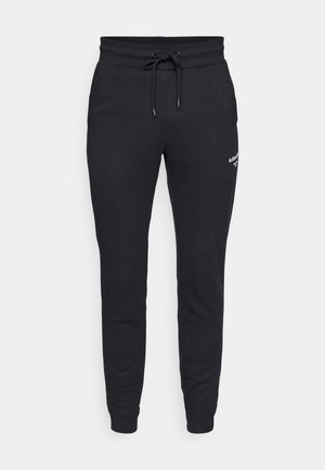 Black jogger pants made of soft fabric, featuring an elastic waistband with a drawstring and tapered legs. Includes small logo detail.