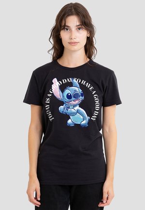 Black cotton t-shirt featuring a cartoon graphic of a blue character with wide ears and text that reads, "Today is a good day to have a good day."